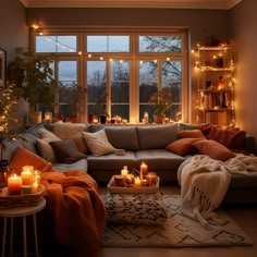 a living room filled with lots of furniture and candles