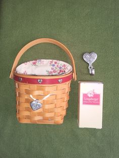 a basket with a bottle opener next to it on a green carpeted floor near a box