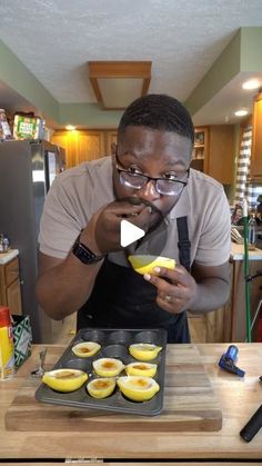 a man in glasses is making some food