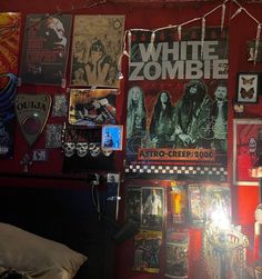 there are many posters on the wall in this room