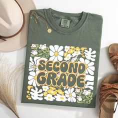 The Comfort Colors Second Grade Teacher Shirt, adorned with a charming floral design, is perfect for educators in their second year. This 2nd Grade Teacher Shirt, ideal for the whole 2nd Grade Teacher Team, combines style and comfort seamlessly. 🌟 Step into your second year with flair and grace! The Comfort Colors Second Grade Teacher Shirt is here to redefine classroom chic! 🎨 Imagine a shirt that blends the tranquility of floral designs with the vibrancy of your teaching spirit. Perfectly crafted for the dynamic 2nd Grade Teacher Team, this shirt isn't just attire--it's an expression! ✨ Envision yourself leading your classroom in unparalleled comfort and style. The Comfort Colors Second Grade Teacher Shirt promises to be as enduring and inspiring as your lessons. Feel the difference, s Teacher 2nd Grade Shirts, 3rd Grade Teacher Shirts, Tee Ideas, 2nd Grade Teacher, Teacher Team, Second Grade Teacher, Teacher Design, Team Shirt, Teacher Tees