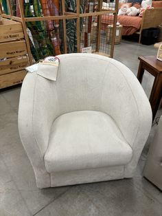 a white chair sitting on top of a cement floor