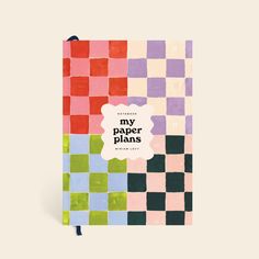 a notebook with the words, my paper plans on it and an image of colorful squares