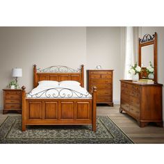 a bedroom scene with focus on the bed and dresser