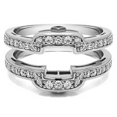 two wedding bands with diamonds on each band and an open heart in the middle, set against