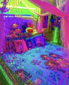 a bed covered in lots of colorful pillows and blankets next to a canopy over it