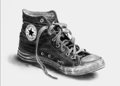 a black and white drawing of a pair of converse shoes with laces on them