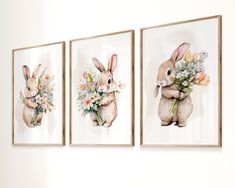 three framed pictures with flowers and rabbits in them on the wall next to each other