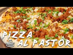 a pizza sitting on top of a pan covered in cheese and toppings with the words pizza al pastor