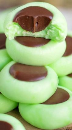 there are green cookies with chocolate on them