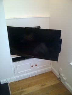 a flat screen tv mounted to the side of a wall