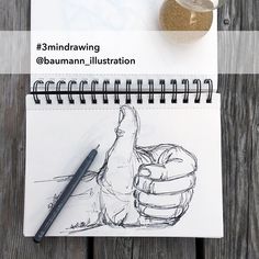 a notepad with a drawing of a hand holding a ballon d'or