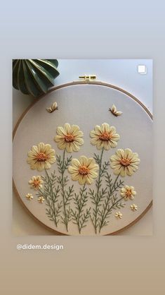 a close up of a embroidery pattern with flowers on it