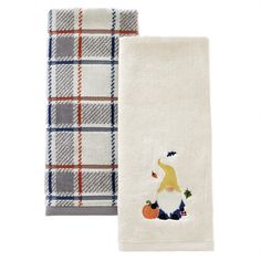 two towels with gnomes and pumpkins on them