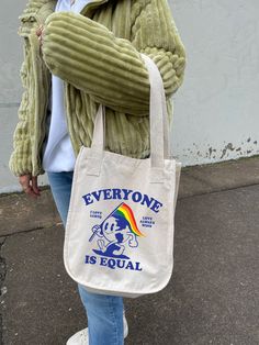 "We are loving this growth mindset aesthetic tote bag. This trendy tote bag goes with almost anything! It's a great way to add some kindness and self love to your day. This organic cotton canvas tote is perfect for everyday use! It can be used as a reusable shopping bag or even just a standard tote bag for all your essentials! * 100% Certified Organic Cotton * Medium Heavy Canvas * Bag Size 14.50\"h x 12.50\"w * Handle Length: 24.25 \" D E S C R I P T I O N * love everyone shirt, good energy shi Pride Day Aesthetic, Ally Aesthetic, Mindset Aesthetic, Tooty Fruity, Pride Ally, Backpack Art, Totes Bag, Gay Books, Colorful Backpacks