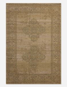 a beige rug with an ornate design on the center and bottom, in various colors