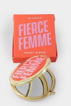 A golden pocket mirror with a red cover and text in pink reading Fierce Femme. A red box with a pink text reading Fierce Femme. Mirror Packaging, Crescent Necklace, Gal Pal, Coffee Enthusiast, Hand Mirror, Pocket Mirror, Mirror Designs, Compact Mirror, Alex And Ani Charm Bracelet