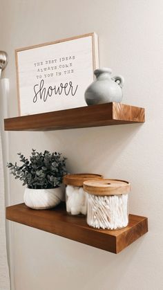 two wooden shelves with vases on them and a sign that says, the best idea is to have home you the shower