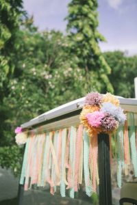 a car decorated with flowers and streamers for a wedding or bridals party