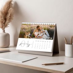 a desk calendar sitting on top of a table