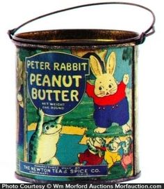 an old tin can with some cartoon characters on the front and bottom, as well as a