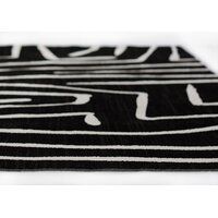 a black and white rug with lines on it