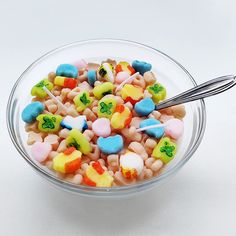 a bowl filled with lots of colorful candy hearts