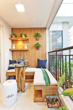 a small balcony with wooden shelves and plants