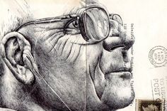 a drawing of an older man with glasses on top of a piece of paper next to a postage stamp