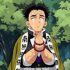 an anime character with his hands folded in front of him and trees behind him as if he were praying