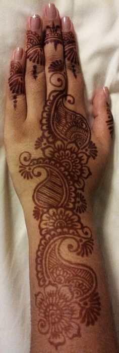 a person's foot with henna tattoos on it