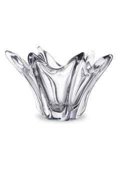 a glass bowl that is sitting on a white surface