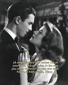 a man and woman standing next to each other in front of a quote from the movie