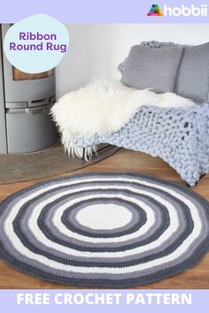 a round rug is on the floor next to a couch and chair, with text overlay that reads free crochet pattern