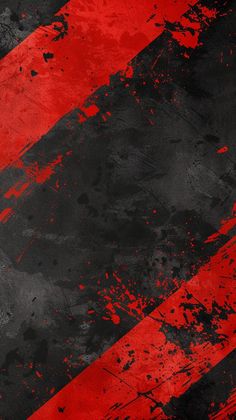 an abstract red and black background with paint splattered on the edges, including diagonal stripes