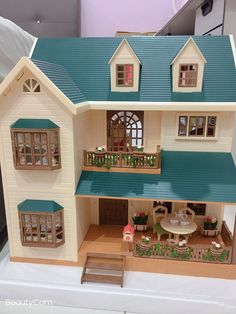 a doll house is shown on a table