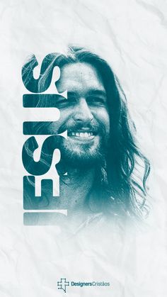 a man with long hair and beard smiling in front of a white background that says jesus