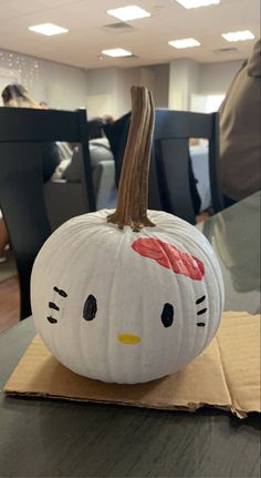 a hello kitty pumpkin sitting on top of a table