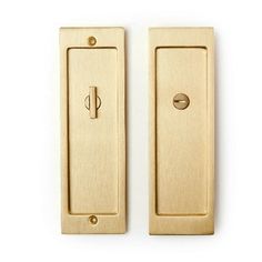 two brass door handles on a white background with one open and the other closed, both facing each other