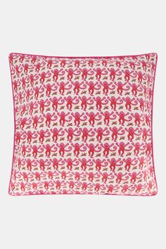 a pink and white pillow with red elephants on it