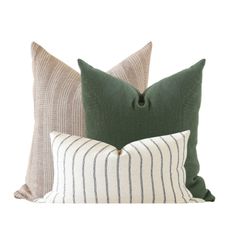 two green and white striped pillows sitting next to each other