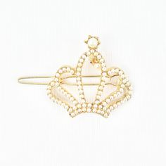 Elevate your hairstyle with this regal vintage hair clip, elegantly designed in the shape of a crown and adorned with lustrous faux seed pearls. This piece captures the glamour of a bygone era, offering a timeless touch of sophistication. The intricate crown detailing, combined with the soft sheen of the pearls, makes it a stunning accessory for special occasions or as a unique addition to everyday style. Perfect for vintage jewelry lovers or those looking to add a royal flair to their collectio Vintage Hairstyles, Vintage Hair, Vintage Hair Clips, Bygone Era, Your Hairstyle, Seed Pearl, Jewelry Lover, Everyday Style, Hair Clip