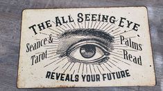 the all seeing eye sign is shown on a wooden surface