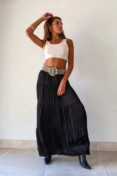 Black satin maxi skirt with an elastic waist band. Lined and 
runs true to size, Sofia wears size Small. Polyester, Hand wash cold. Paired with the Michelle Crop Top, and the OZ Beaded belt. #skirtfashion #fashion #crop #cropped #top #long #maxiskirtoutfitsummer #summer #shopmycloset #tiktok #ideas #instagram #inspiration #aesthetic #travel #vacation #clothes #closet Maxi Length Rayon Skirt With Elastic Waistband, Chic Rayon Maxi Skirt With Elastic Waistband, Chic Black Maxi Dress With Elastic Waistband, Chic Rayon Tiered Maxi Skirt, Black Maxi Dress With Elastic Waistband, Black Maxi Length Bottoms With Elastic Waistband, Black Wide Leg Maxi Dress For Spring, Black Relaxed Maxi Dress, Black Rayon Maxi Skirt For Spring