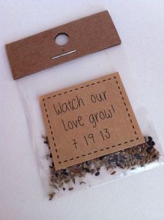 a label that says watch our love grow on it next to some seeds in a package