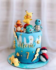 a pokemon themed birthday cake with all the characters on it's top tiers