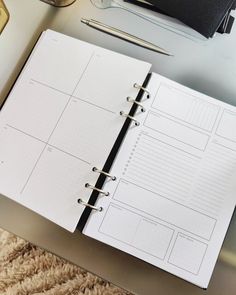 an open planner sitting on top of a table