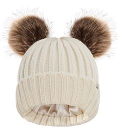 a white hat with two brown pom poms