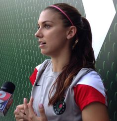 a female tennis player talking to the media