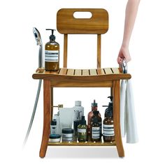 a wooden chair with soaps, lotions and hand sanitizers on it